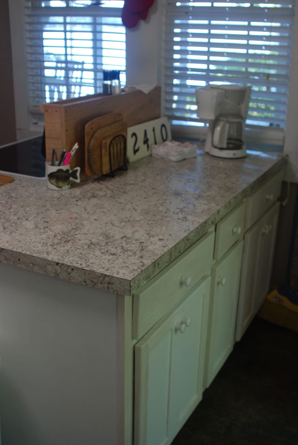 The kitchen peninsula adds more workspace for food prep or a buffet.