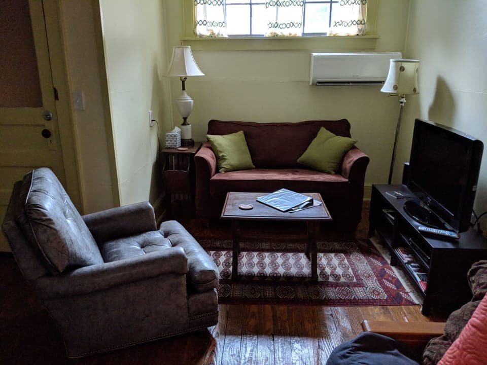 TV/living room with love seat and chair.