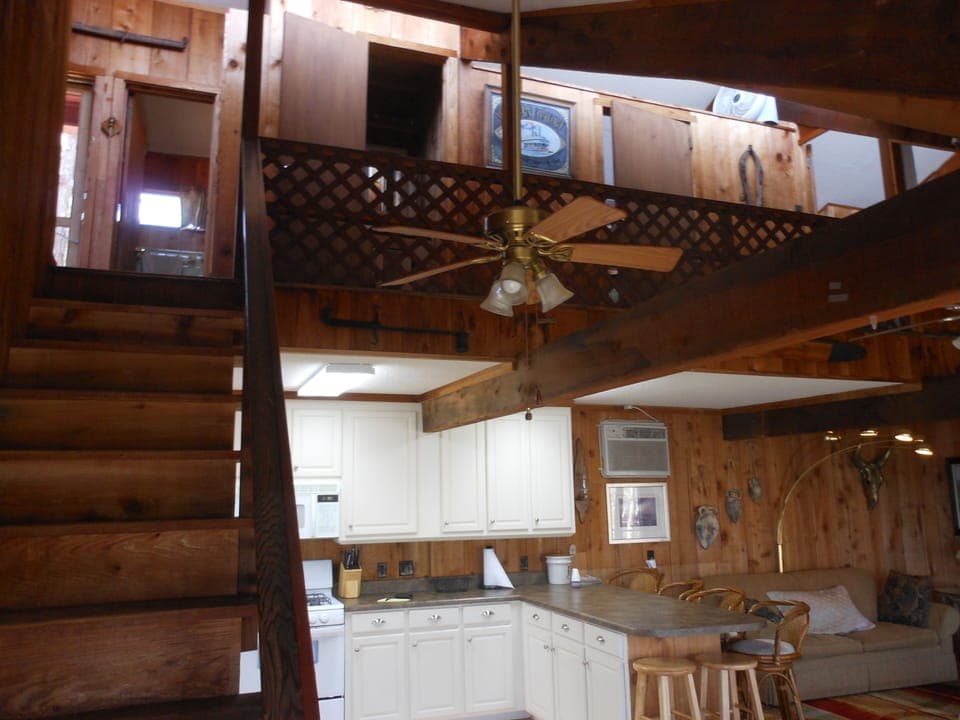 View from stairs of kitchen and upper bedrooms