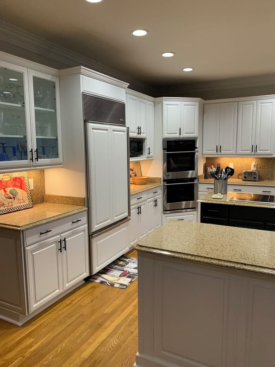 Kitchen with double convection ovens and subzero refrigerator.