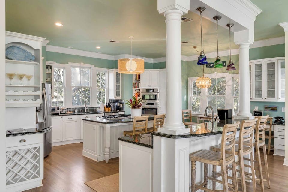 Your large kitchen features elegant columns and a breakfast nook