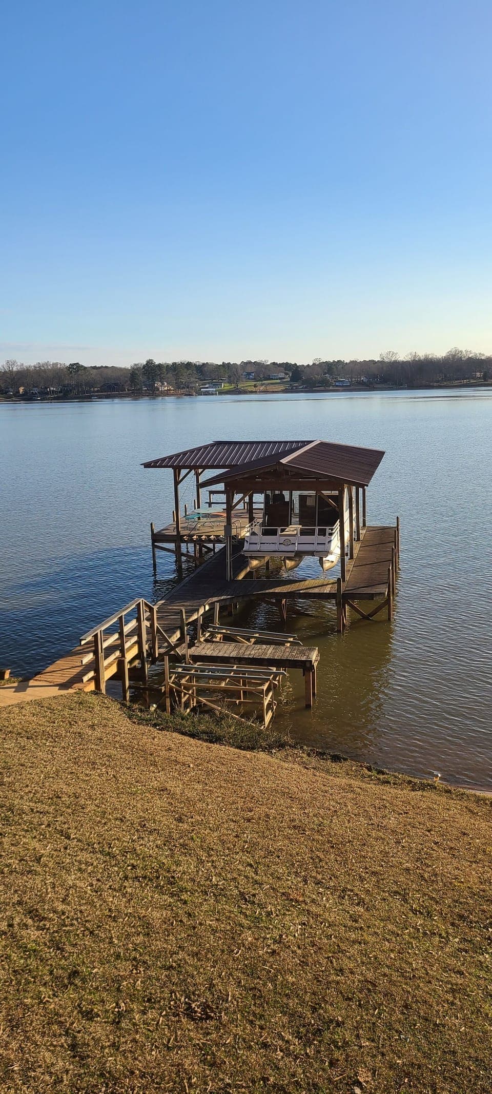 Boat dock with covered area and seating. Boatlift not available. 2 tie up areas
