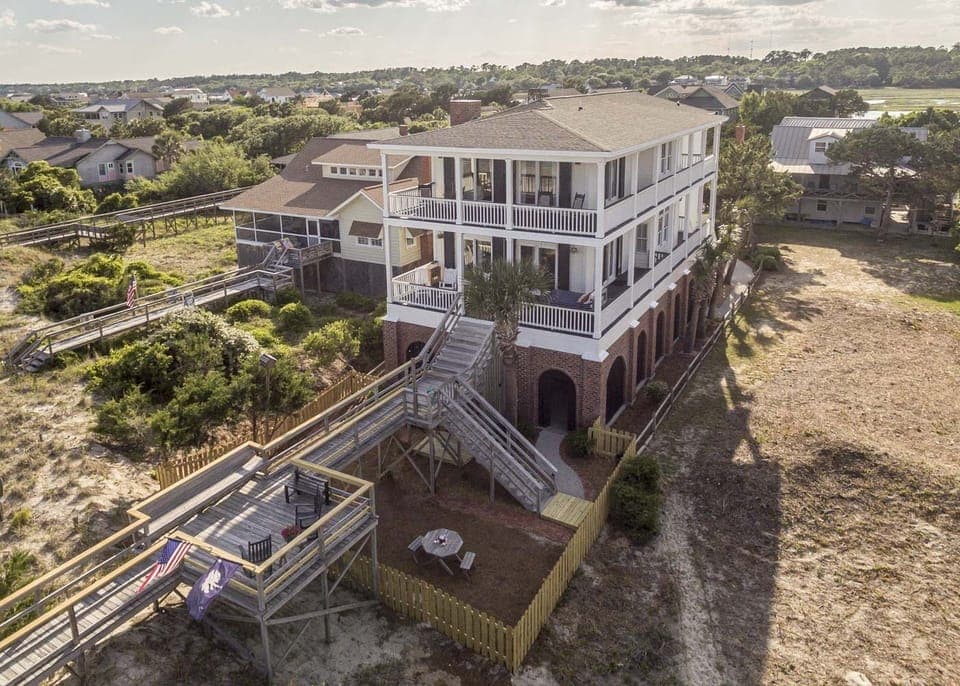 Aerial View of House and fenced in front yard