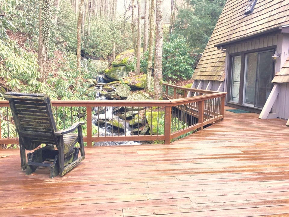 Large, private deck with water cascading in front and beneath