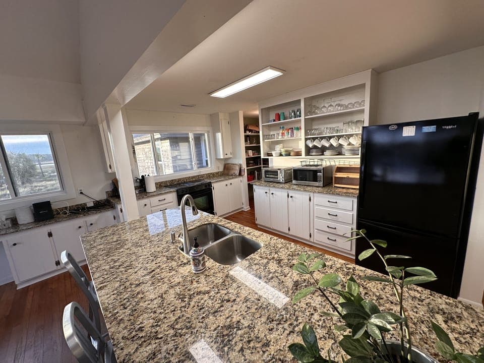 Two pantries, large fridge and open design provides a space to be together.