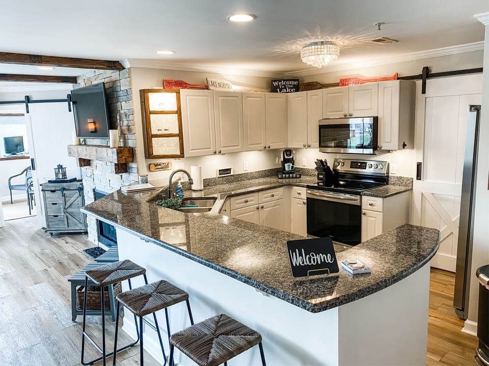 Fully stocked kitchen w/2 tier granite tops; updated light fixtures throughout!