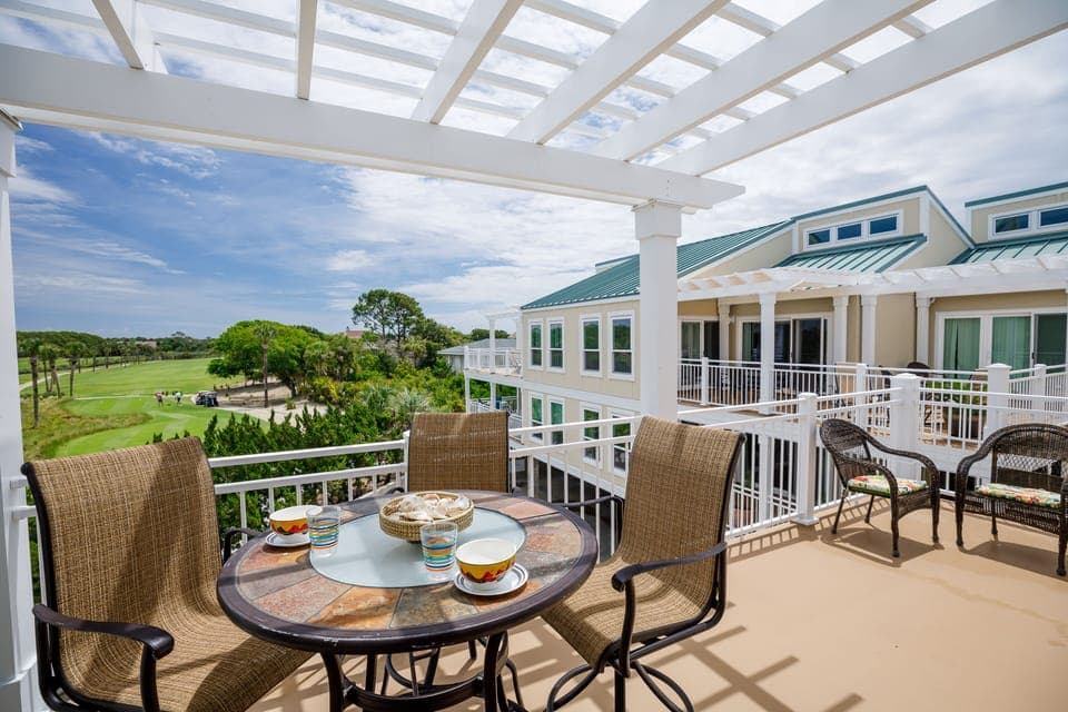Deck with Table and Chairs over looking # 10 of Ocean Winds Golf Course