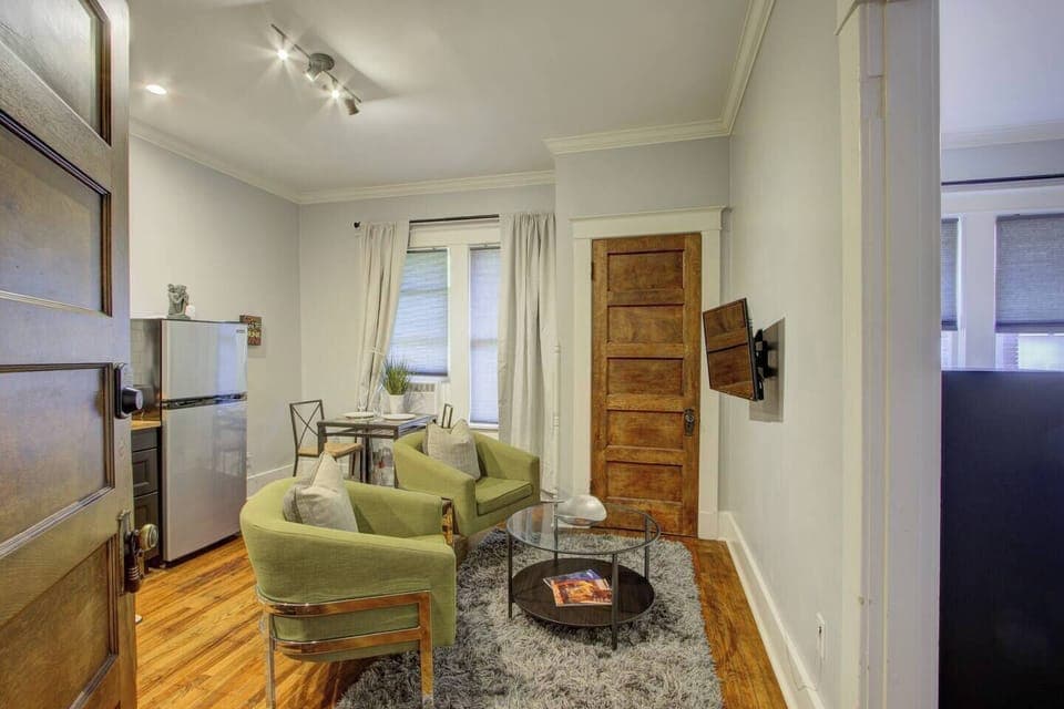 Bedroom with a direct outlook into the living room for a bright, open feel.