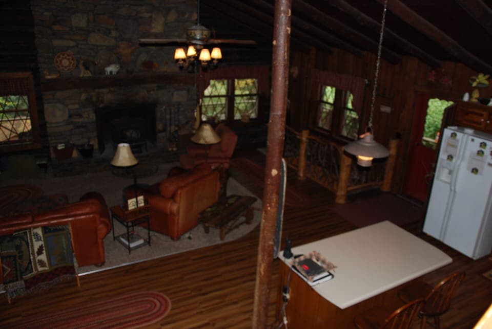 Kitchen Island and stairs to Game Room on right with Mountain Laurel Bannister
