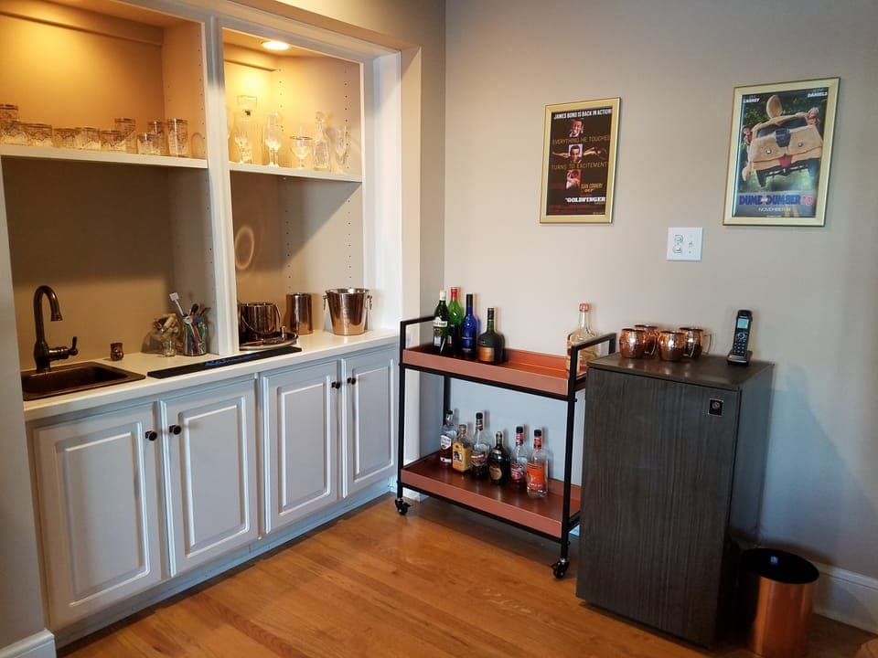 Media room also features wet bar, refrigerator and rolling cocktail cart