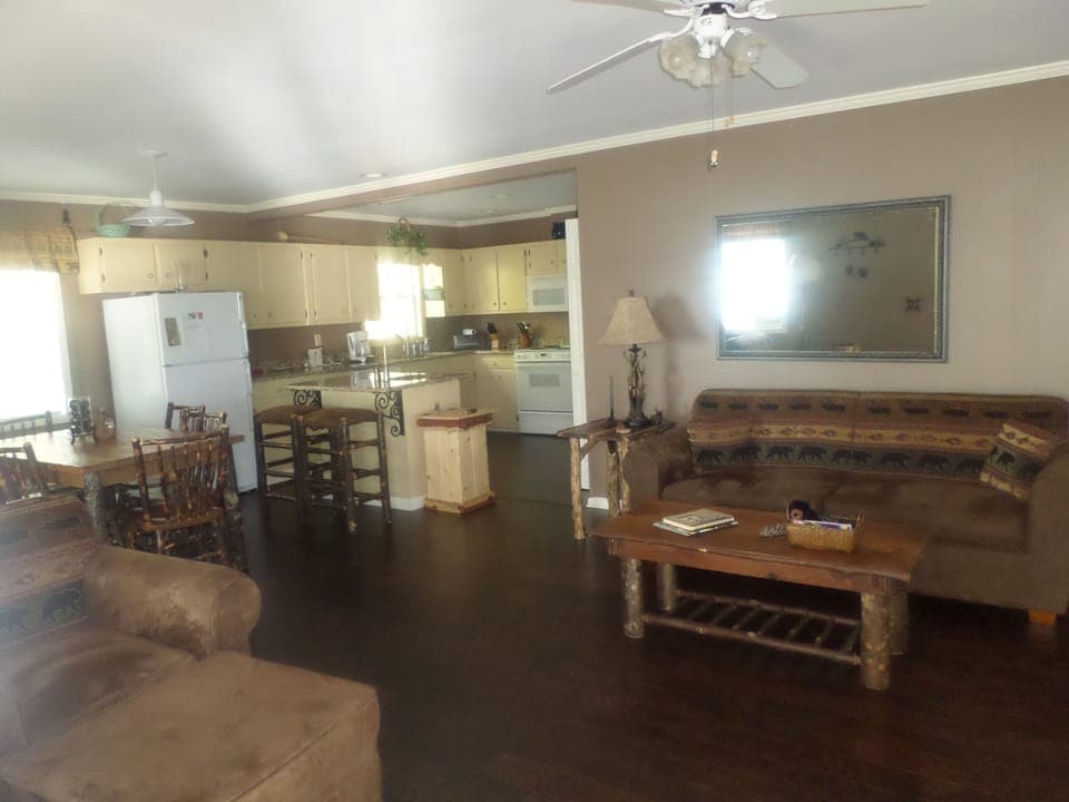 Living room with rustic furniture.   Hardwoods throughout.