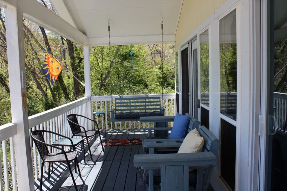 Relax on the porch as you look at the lake.