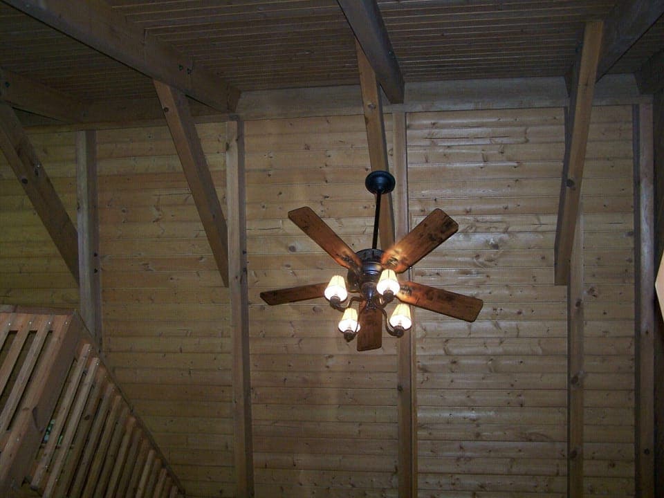 Living room ceiling open up to the roof beams.