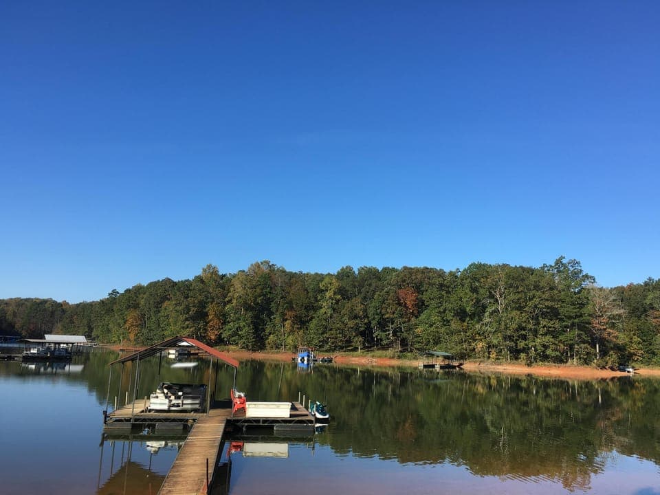 Our covered dock has a sun deck and swim ladder.
