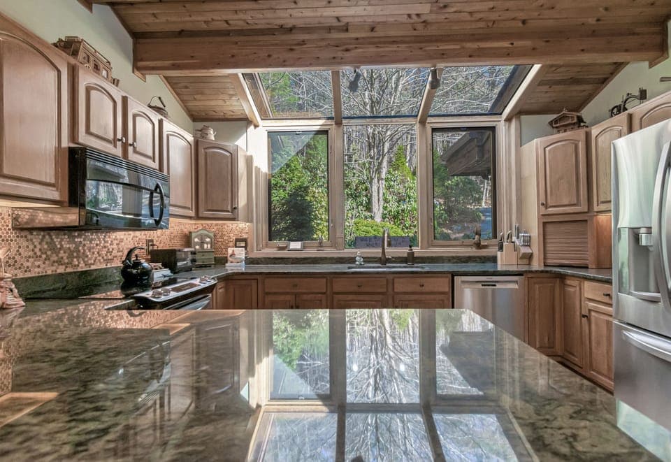 Large  Kitchen with Granite counters and Fully Equipped utensils, pans etc.