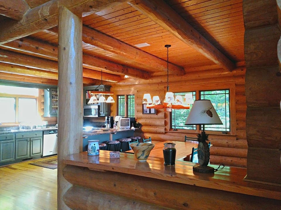 Open floorplan with bar between living room and dining room