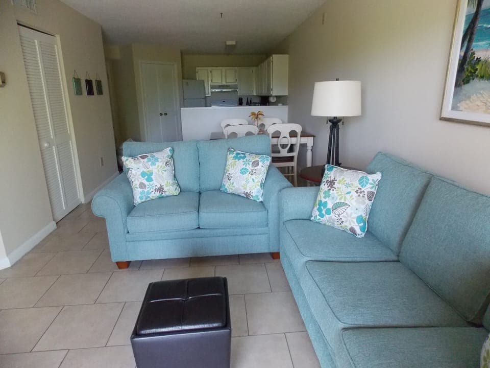 Living room with Kitchen in the background