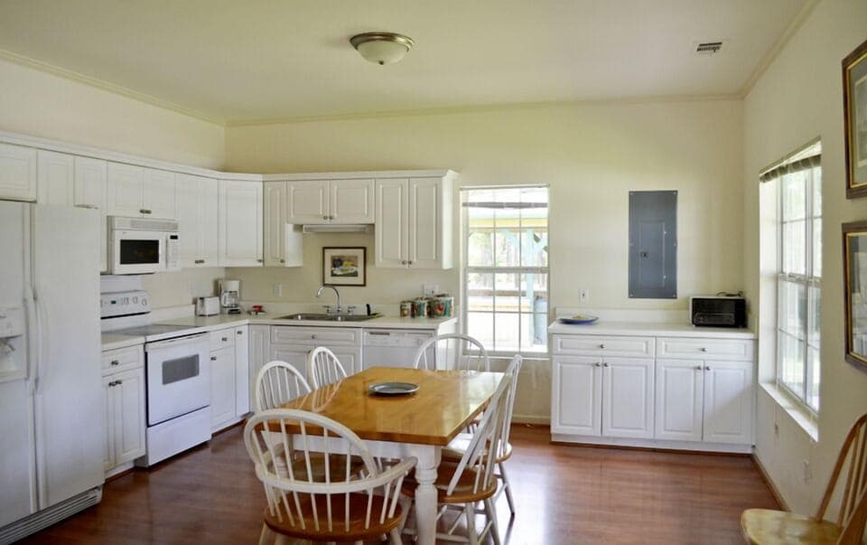 Bright, cheery kitchen with seating for eight guests.