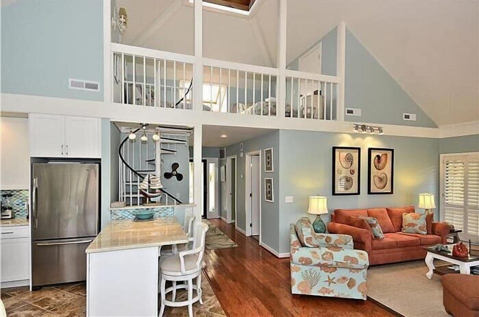 View back down entrance hall.  Circular stairs leading to loft and skylight