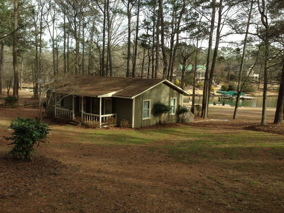 Cottage with lake in background