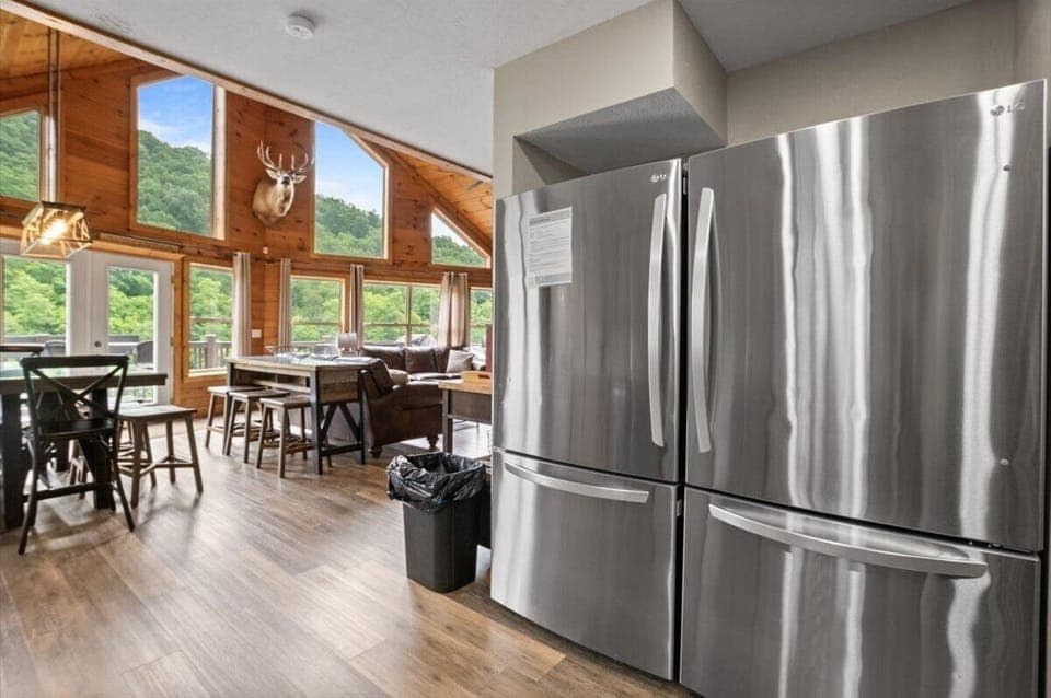 The kitchen has 2 refrigerators, fully stocked with large & small appliances.