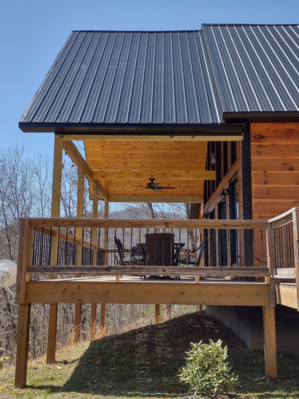 Large covered deck with lighting and fan