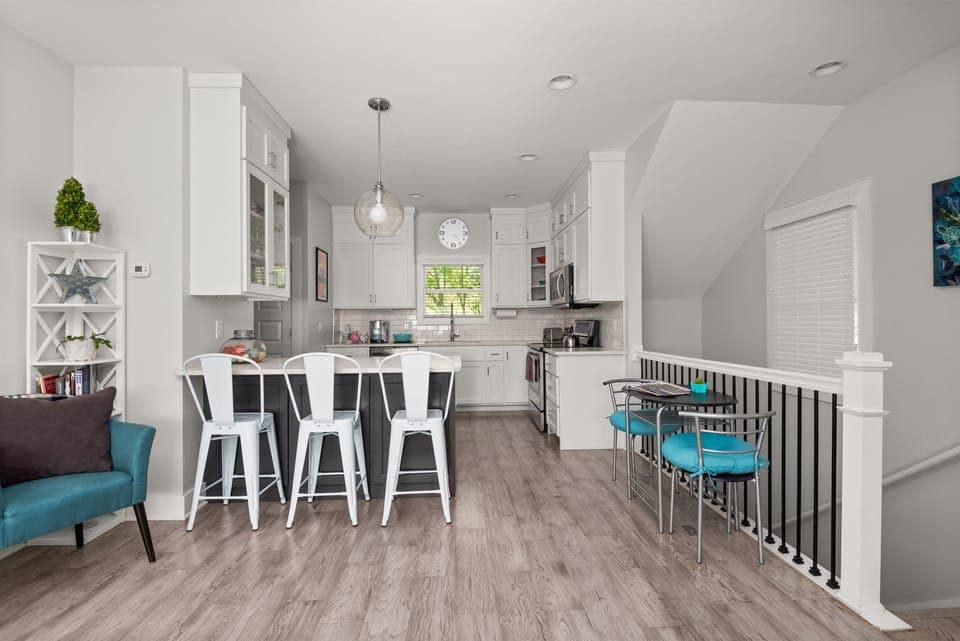 In addition to the bar stools and balcony seating, there's an extra table-for-two