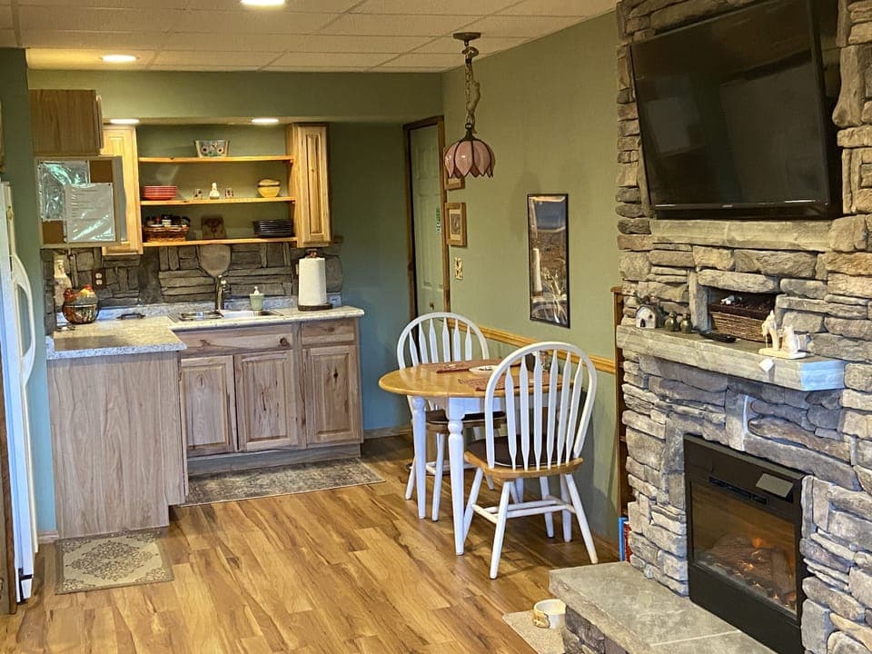 Hot plates, drip coffee, toaster oven, air fryer, and blender stowed in pantry.