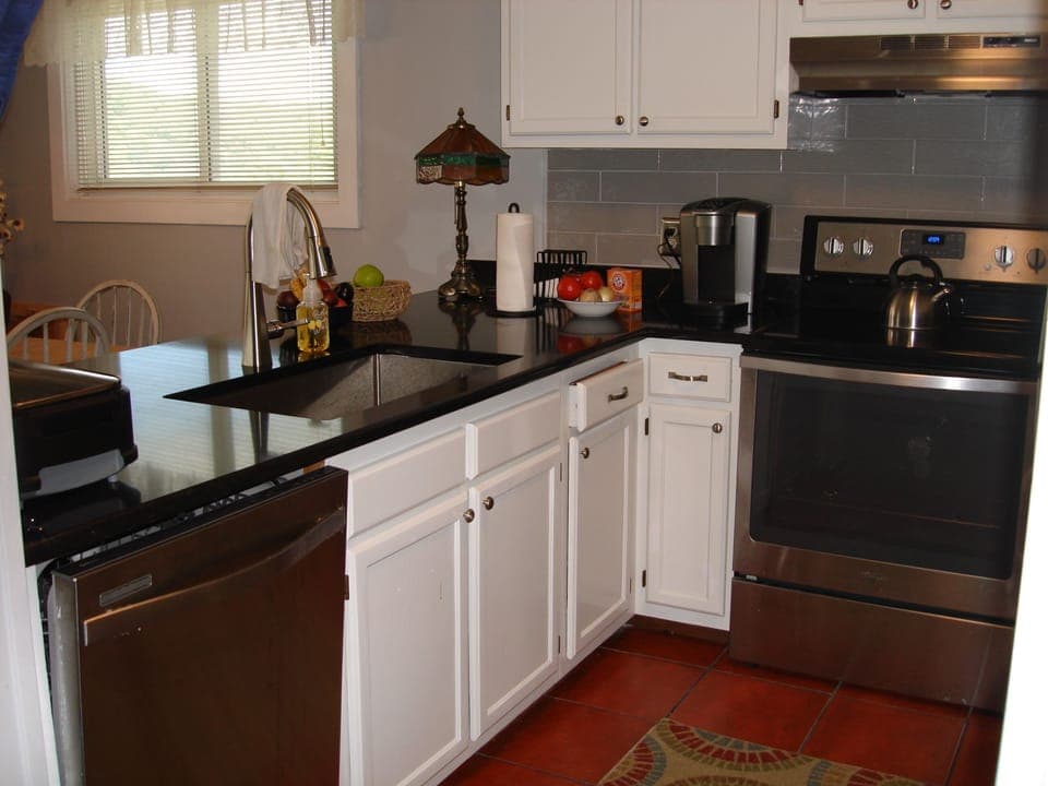 kitchen with new labyrinth quartz counter tops & stainless steel appliances