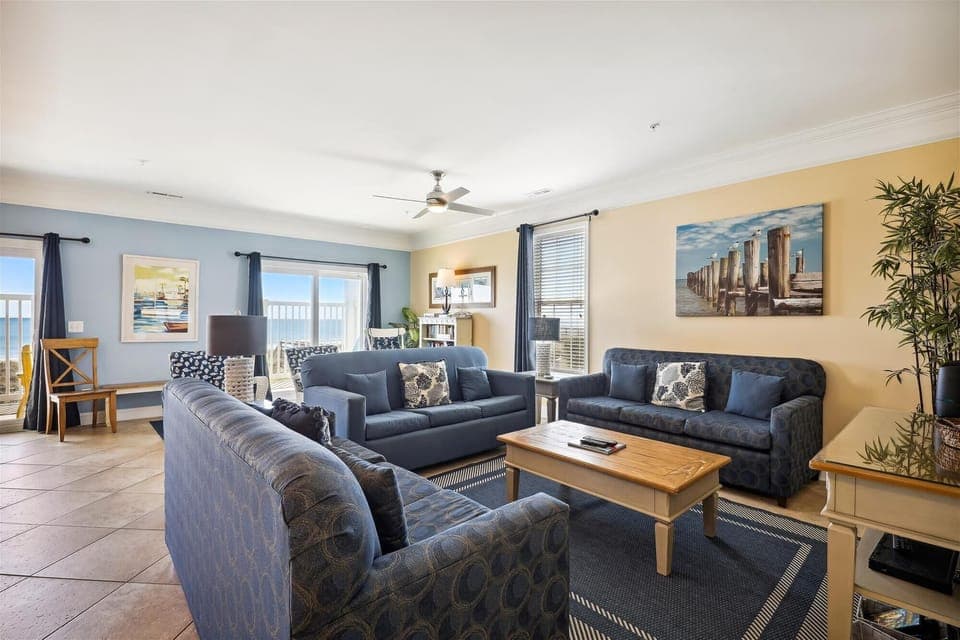 Comfy sofas provide a place to relax and enjoy a family movie night.