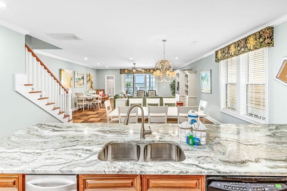 Cook and connect in this stunning open-concept kitchen featuring beautiful marble countertops and seamless flow to your dining and living areas.