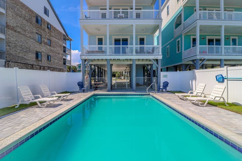 Your private pool oasis awaits with comfortable loungers and pristine turquoise water for refreshing afternoon dips.