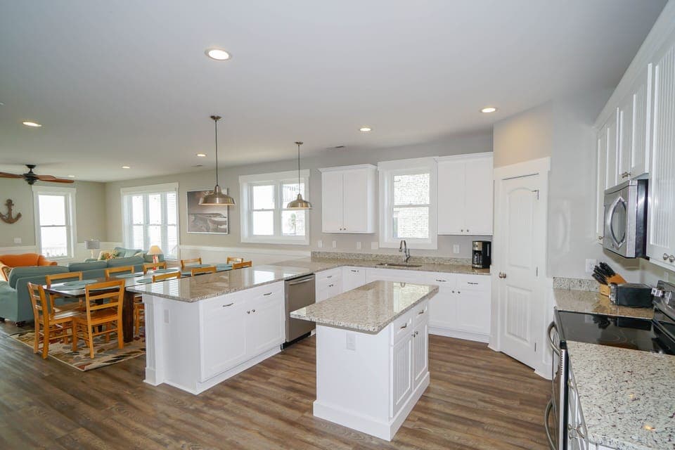 Discover your dream kitchen with granite countertops, stainless steel appliances, and a spacious island perfect for cooking memorable meals with loved ones.