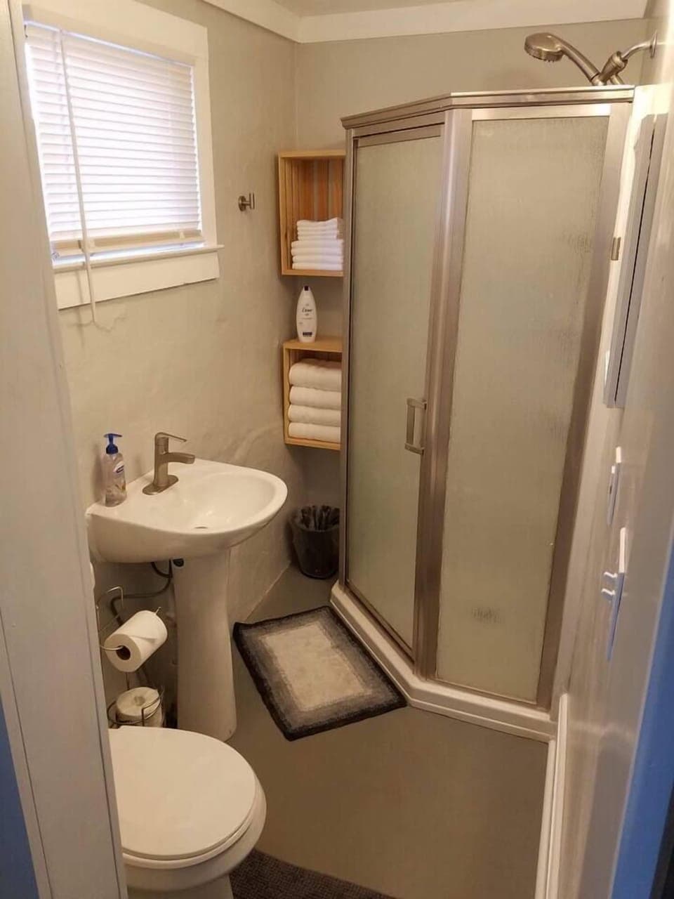 Bathroom with standing shower and pedastal sink