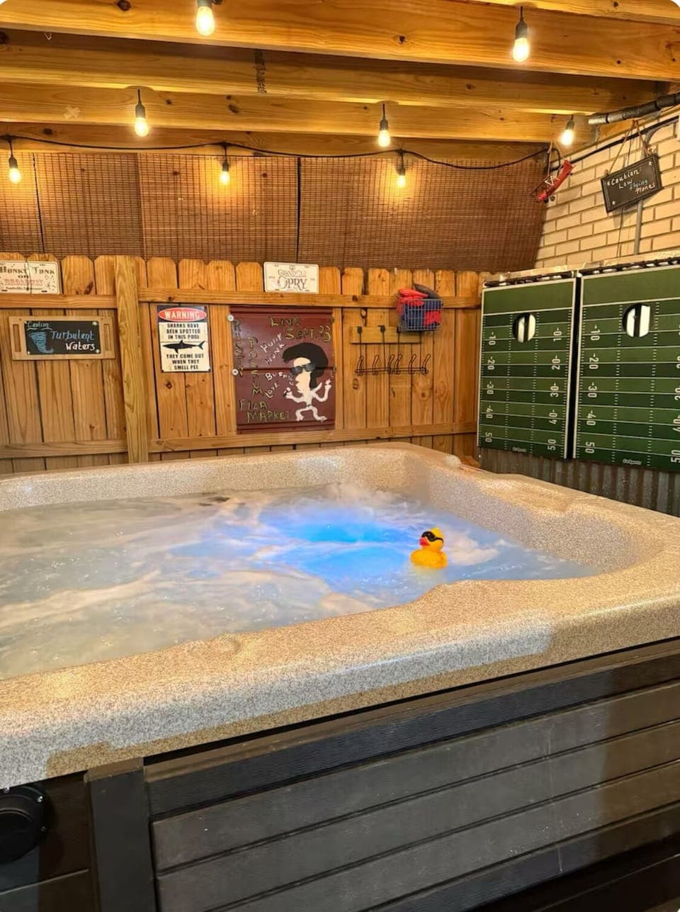 Hot tub jacuzzi with sitting area and bags game for yard