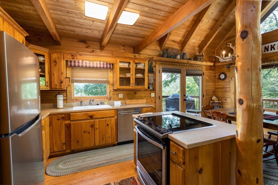Open Kitchen has Stainless Fridge and Dishwasher