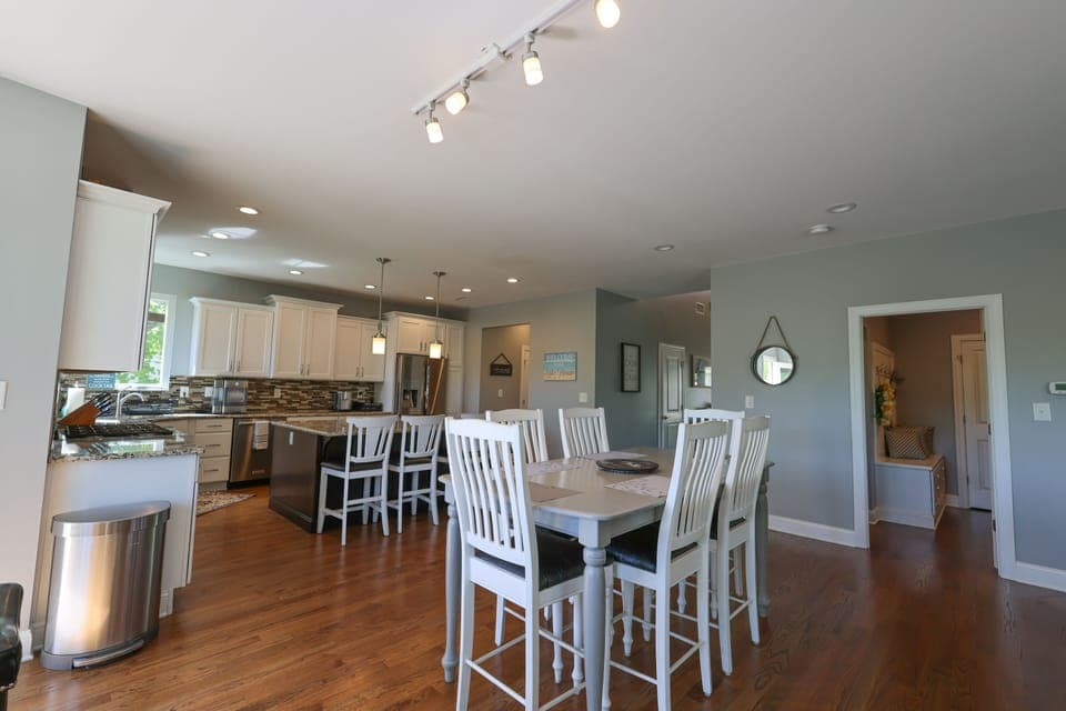 Spacious kitchen for everyone. Seating for 10-12 plus 12 in the dining room.  