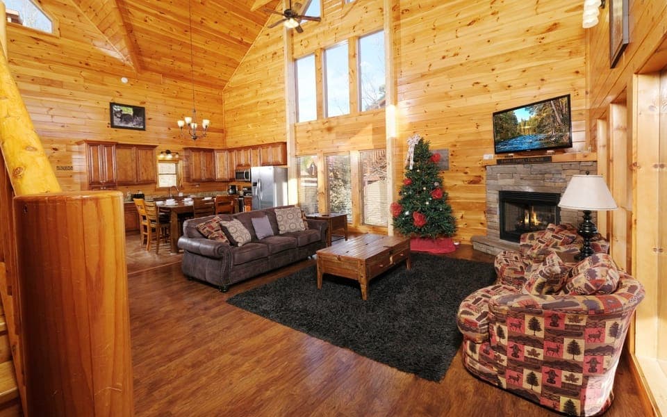 Vaulted ceiling and fireplace - spacious cabin living with a view.