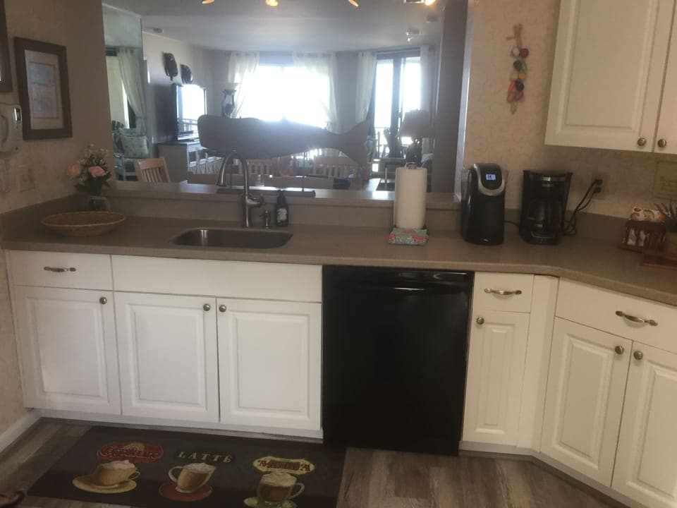 Large kitchen fully equipped with appliances, dishes, pots and pans, keurig, etc