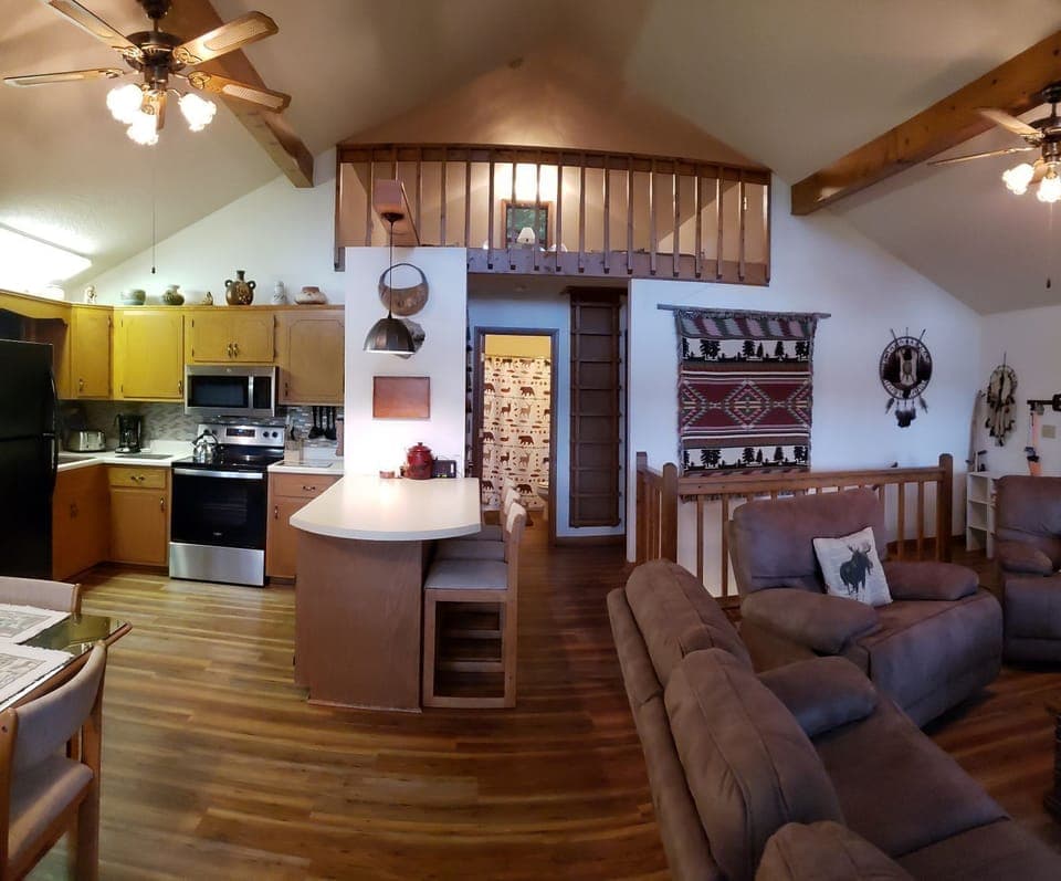 Fully stocked kitchen with peninsula for additional seating.