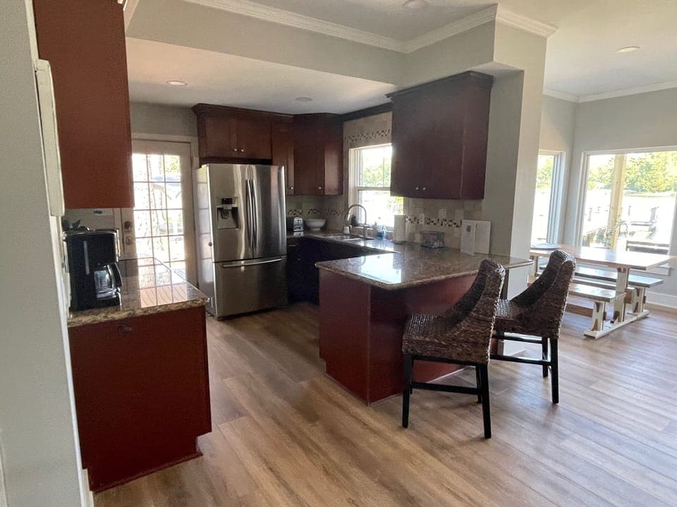 The updated and fully stocked kitchen, with an incredible lake view! 