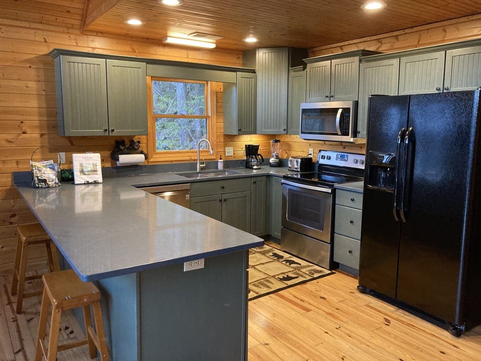 Well stocked kitchen with new quartz countertops and new appliances 