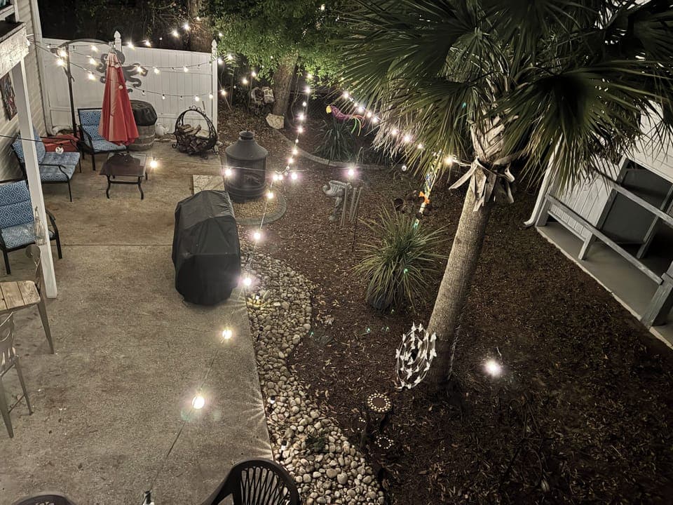 Great outdoor space includes fire pit plus outdoor bar and seating area
