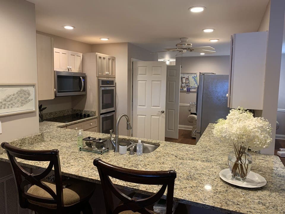 View into kitchen from bar area-with 4 barstools