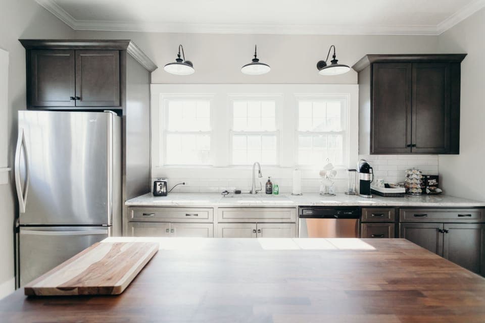 Farmhouse kitchen with windows that let in lots of light. 