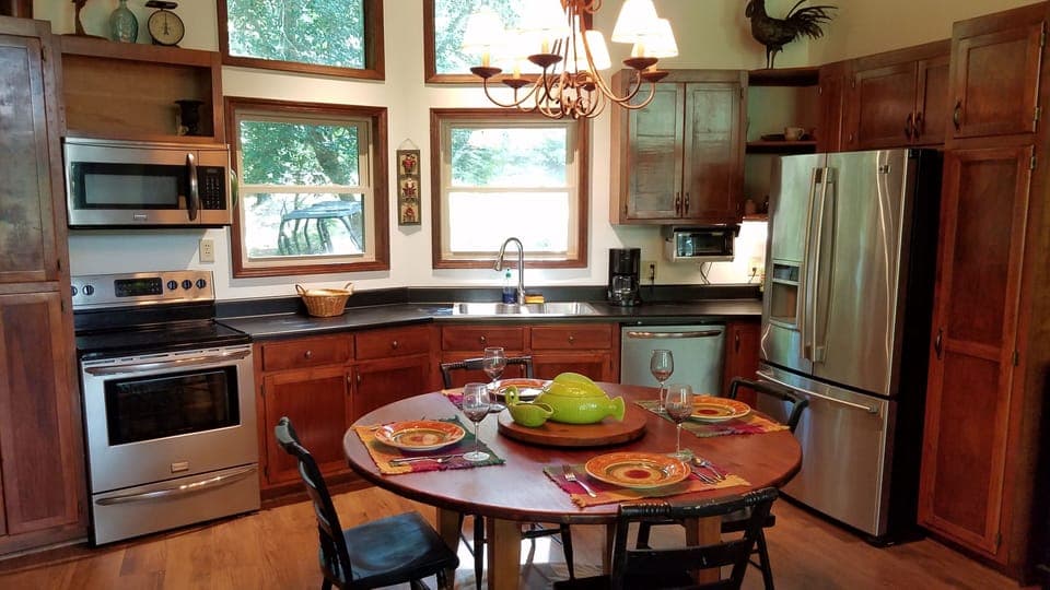 60" Dining table seats six comfortably, but can handle eight in a pinch