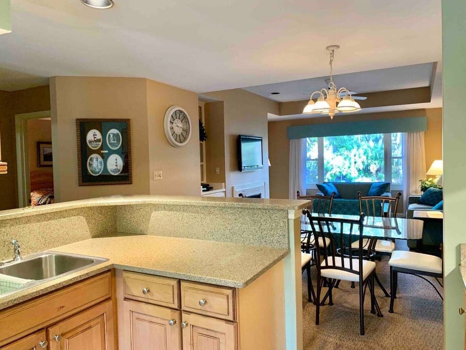 View of kitchen, dining area, den