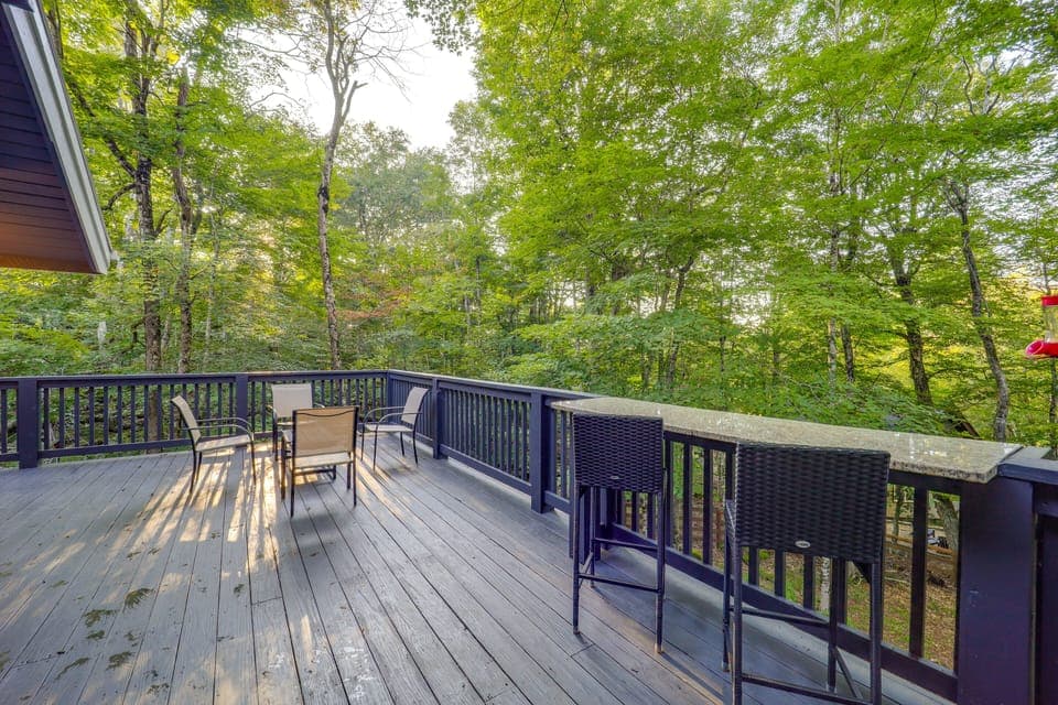Wraparound Deck | Fenced-In Yard | Wooded Surroundings
