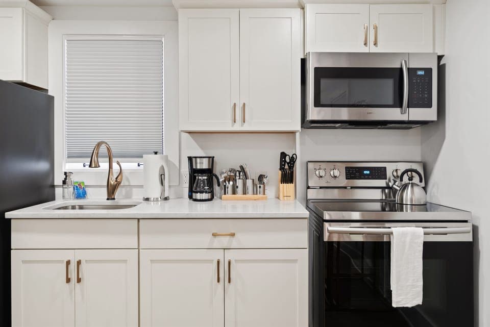 The kitchen is well-equipped with cooking and baking necessities
