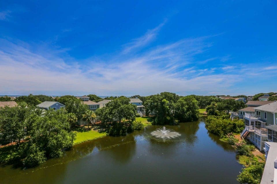 This lagoon behind the home contains alligators, fish & turtles and is frequently visited by deer.